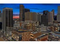 Expansive city view featuring prominent buildings and a colorful sunset sky at 1020 15Th St # 24H, Denver, CO 80202