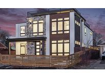 Stylish home featuring a stone facade, wooden accents, modern windows, and rooftop terrace at 2720 N Saint Paul St, Denver, CO 80205
