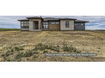 Craftsman style home with stone and wood accents at 9719 Canyon Wind Pt, Parker, CO 80138