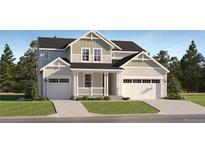 Charming two-story home with a two-car garage and a well-manicured front yard in a suburban neighborhood at 39867 Floyd St, Elizabeth, CO 80107