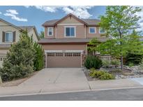Charming two-story home featuring a two-car garage, a landscaped front yard, and a welcoming facade at 2908 Open Sky Way, Castle Rock, CO 80109
