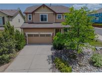 Charming two-story home with a well-maintained yard and inviting curb appeal at 2908 Open Sky Way, Castle Rock, CO 80109