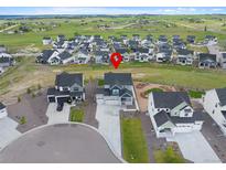 Beautiful aerial view of a two-story home in a suburban neighborhood with well-maintained landscaping at 1172 Elbridge Cir, Elizabeth, CO 80107