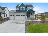 Charming two-story home featuring a spacious three car garage and quaint front porch at 1172 Elbridge Cir, Elizabeth, CO 80107