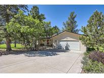 Charming single-Gathering home with a two-car garage and a well-manicured front yard at 5583 Thunder Hill Rd, Parker, CO 80134