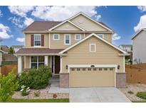 Charming two-story home with a well-maintained lawn and a two-car garage, perfect for families at 2510 E 160Th Pl, Thornton, CO 80602