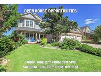 Charming two-story home with a manicured lawn and mature trees, offering an inviting curb appeal for potential buyers at 2742 S Braun Way, Lakewood, CO 80228
