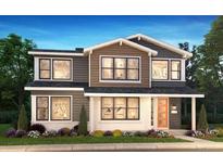 Charming two-story home with landscaped yard, modern design, and inviting entryway, perfect for Gathering living at 11196 Vibrato Ln, Parker, CO 80134