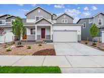 Charming two-story home featuring a two-car garage and well-maintained landscaping at 1368 Orchard St, Brighton, CO 80601