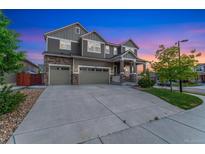 Charming two-story home with a three car garage and stone accents at 10003 Atlanta St, Parker, CO 80134