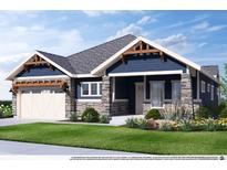Charming single-Gathering home with a stone and blue siding, a well-manicured lawn, and an attached two-car garage at 14111 Blue Stem St, Broomfield, CO 80020