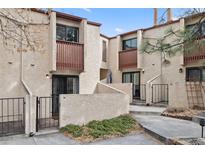 Inviting townhome exterior with private entrances, balconies, and well-maintained stucco at 1060 S Parker Rd # 19, Denver, CO 80231