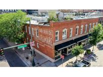 Charming brick building exterior with classic architectural details and street view at 1510 Wazee St # 3, Denver, CO 80202