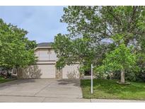 Charming home featuring a three-car garage and mature trees in a well-maintained neighborhood at 2307 S Ensenada St, Aurora, CO 80013