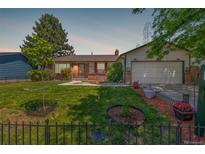 Charming single-Gathering home features a well-manicured lawn and a delightful, welcoming entrance at 18083 E Atlantic Dr, Aurora, CO 80013