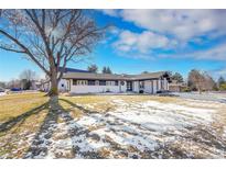 Stunning ranch home exterior with a modern design and landscaping at 6220 E 5Th Ave, Denver, CO 80220