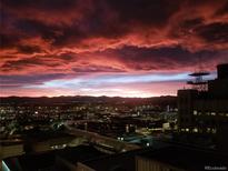 Dramatic view of the city skyline against a colorful sunset sky at 891 14Th St # 2205, Denver, CO 80202