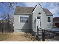 Charming cottage home featuring a well-maintained front yard, neutral paint and a peaked roof line at 118 S Dale Ct, Denver, CO 80219