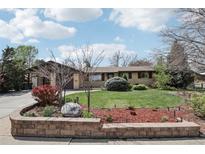 Charming ranch-style home with well-maintained lawn, brick accents, and mature landscaping, offering great curb appeal at 1164 W 101St Pl, Northglenn, CO 80260
