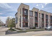 Contemporary townhome featuring modern architecture, private balconies, and attractive curb appeal in a desirable urban location at 7010 W Alaska Dr, Lakewood, CO 80226