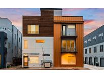 Modern home with a unique facade, showcasing a blend of wood, concrete, and metal accents at 1836 Grove St # 105, Denver, CO 80204