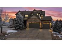 Stunning two-story home with stone accents and a three-car garage at 7603 Yule Ct, Arvada, CO 80007