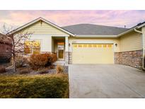 Charming single-Gathering home featuring a two-car garage and well-maintained landscaping at 19377 E Radcliff Pl, Aurora, CO 80015