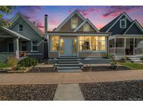 Charming single-Gathering home with a well-maintained front yard and inviting entrance with large windows at 2922 N High St, Denver, CO 80205