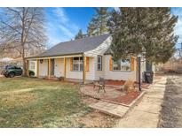 Updated craftsman home with a welcoming front porch and landscaped yard at 3540 E Jewell Ave, Denver, CO 80210