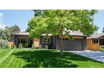 Charming single-story home featuring a freshly manicured lawn and a two-car garage at 1830 S Fillmore St, Denver, CO 80210