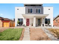 Modern townhome featuring a contemporary design, light stucco, and eye-catching red door and a gray door at 1333 Raleigh St, Denver, CO 80204