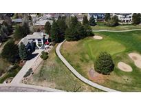 Aerial view of the home situated on a golf course at 6961 Salvia St, Arvada, CO 80007