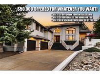 Gorgeous exterior view featuring a three-car garage, landscaped yard, and modern architectural design at 6961 Salvia St, Arvada, CO 80007