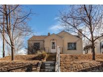 Cute bungalow with front steps and small yard at 2600 S Downing St, Denver, CO 80210