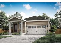 Tan house with white garage door, landscaping, and a small front yard at 18338 E 93Rd Pl, Commerce City, CO 80022