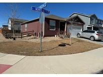 Well-maintained single-Gathering home with manicured lawn and attached two-car garage at 2003 Monte Vista Dr, Lochbuie, CO 80603