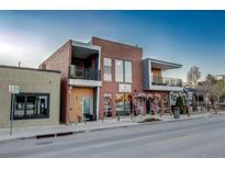 Charming brick building with inviting storefront, perfect for a restaurant with balconies at 4258 Tennyson St, Denver, CO 80212