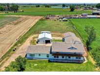 Sprawling ranch home with barn, fenced yard and country views at 13080 County Road 19, Platteville, CO 80651