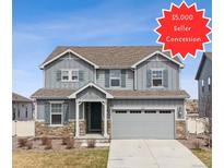Charming two-story home boasts stone accents, gray siding, and a $5,000 seller concession at 6243 Saddle Bow Ave, Parker, CO 80134