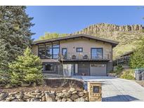 Modern two-story home featuring a balcony and well-maintained landscaping at 424 Peery Pkwy, Golden, CO 80403