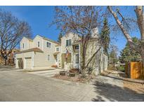 Charming two-story home featuring an attached garage and traditional siding at 12935 W 64Th Dr # D, Arvada, CO 80004