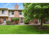 Charming brick townhouse with a well-maintained lawn and mature trees at 10310 E Jewell Ave # 55, Aurora, CO 80247