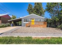 Charming single-story home featuring a new wooden porch and bright yellow front door at 695 S Quitman St, Denver, CO 80219