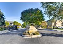 Community entrance with a boulder sign, landscaping, and gated entries to the Hilltop neighborhood at 11017 Meade Ct, Westminster, CO 80031