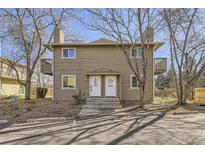 Charming two-story home with a cozy front porch and well-maintained landscaping at 4529 Barnacle Ct, Boulder, CO 80301