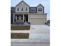 Charming two-story home with a two-car garage and covered porch, inviting curb appeal at 5621 W 141St Ln, Broomfield, CO 80020