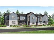 Charming townhome with stone accents and colorful landscaping for great curb appeal at 2969 E 103Rd Dr, Thornton, CO 80229