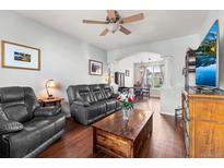 Comfortable living room with a plush sofa, wooden coffee table, and stylish decor at 85 Uinta Way # 603, Denver, CO 80230