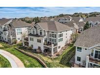 Stunning three-story home boasts a private patio and large windows offering beautiful views at 3109 Newport Cir, Castle Rock, CO 80104