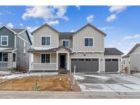 Charming two-story home with a three-car garage and inviting front porch at 39182 Clymer St, Elizabeth, CO 80107
